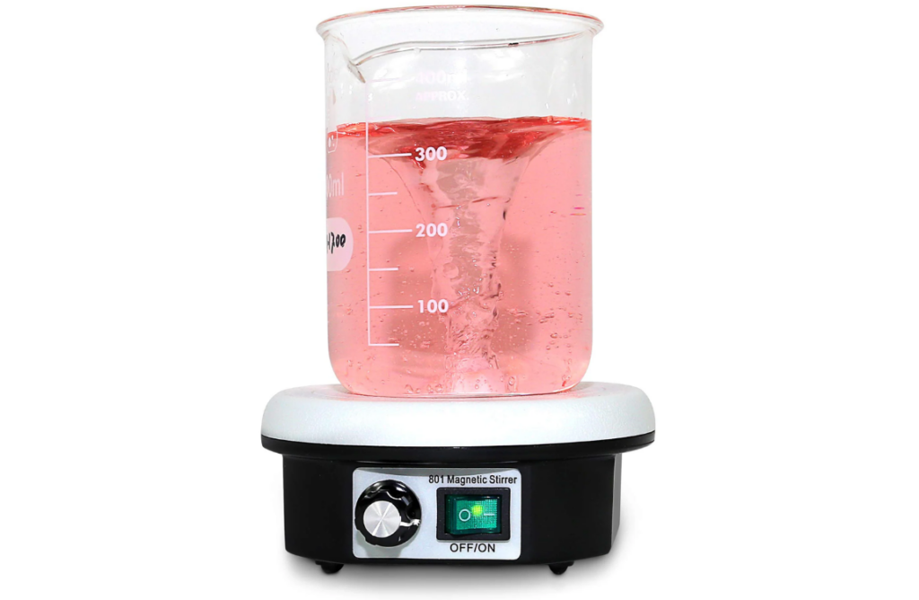 Magnetic stir plate mixing a beaker of sample solution during pH measurement