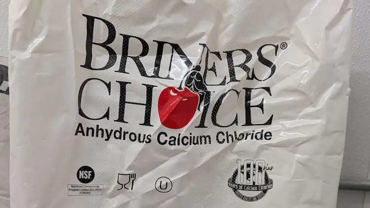 A bag of anhydrous calcium chloride for use in food production.